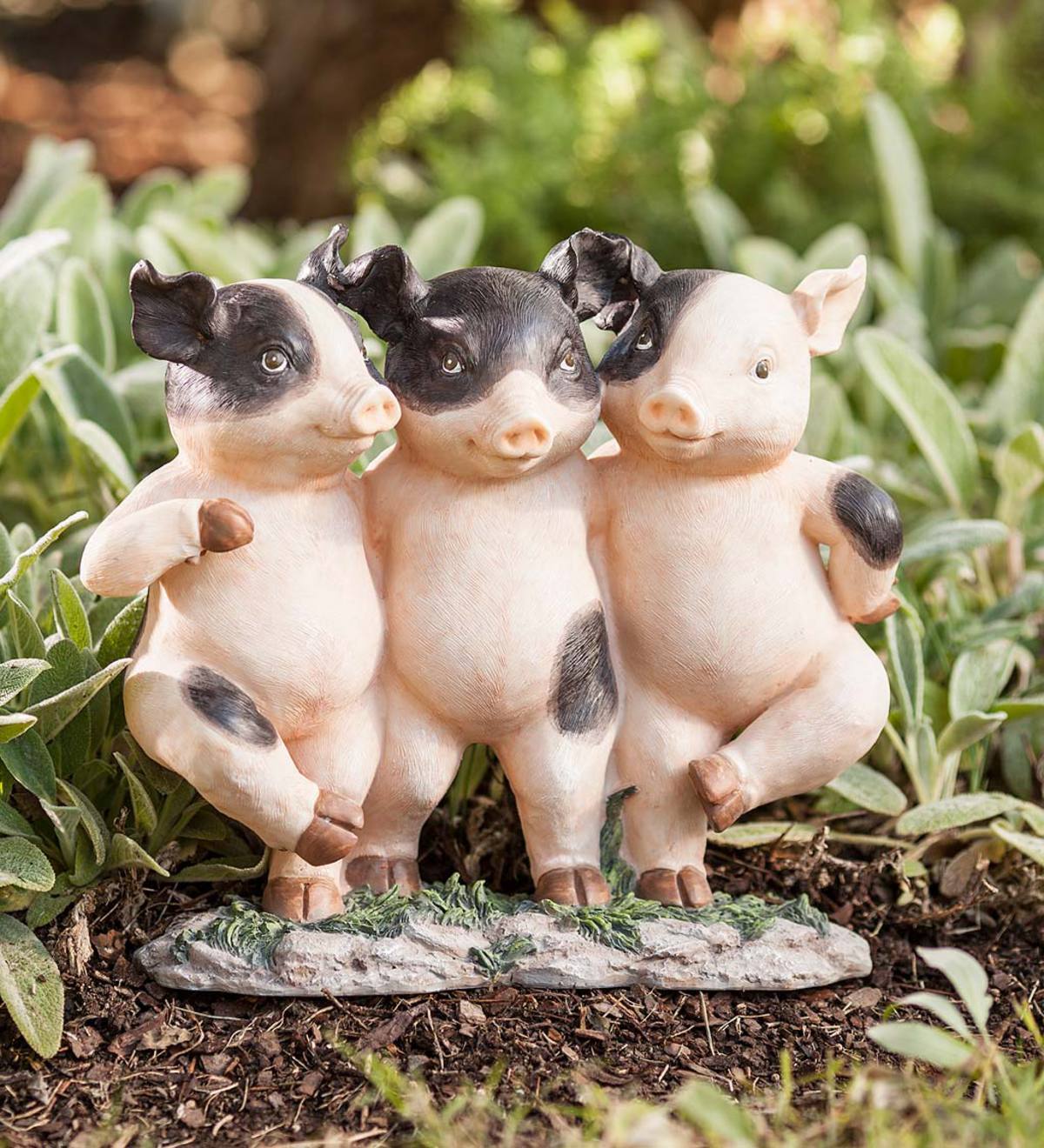Three Dancing Pigs Statue