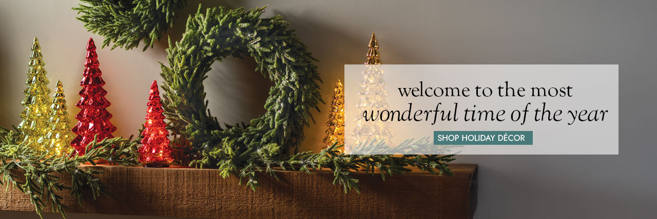Image of Glass trees with wreaths and garland on mantel & wall - welcome to the most wonderful time of the year SHOP HOLIDAY DECOR