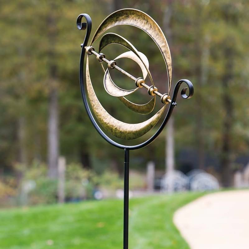 Three-Ring Galactic Metal Wind Spinner