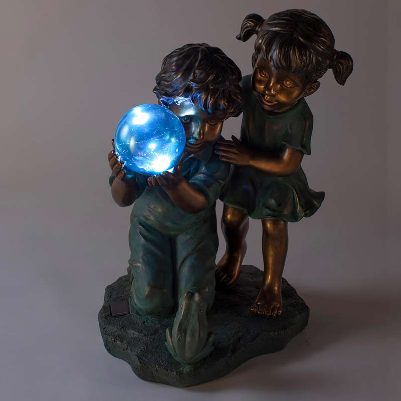 Children with Solar Ball Sculpture